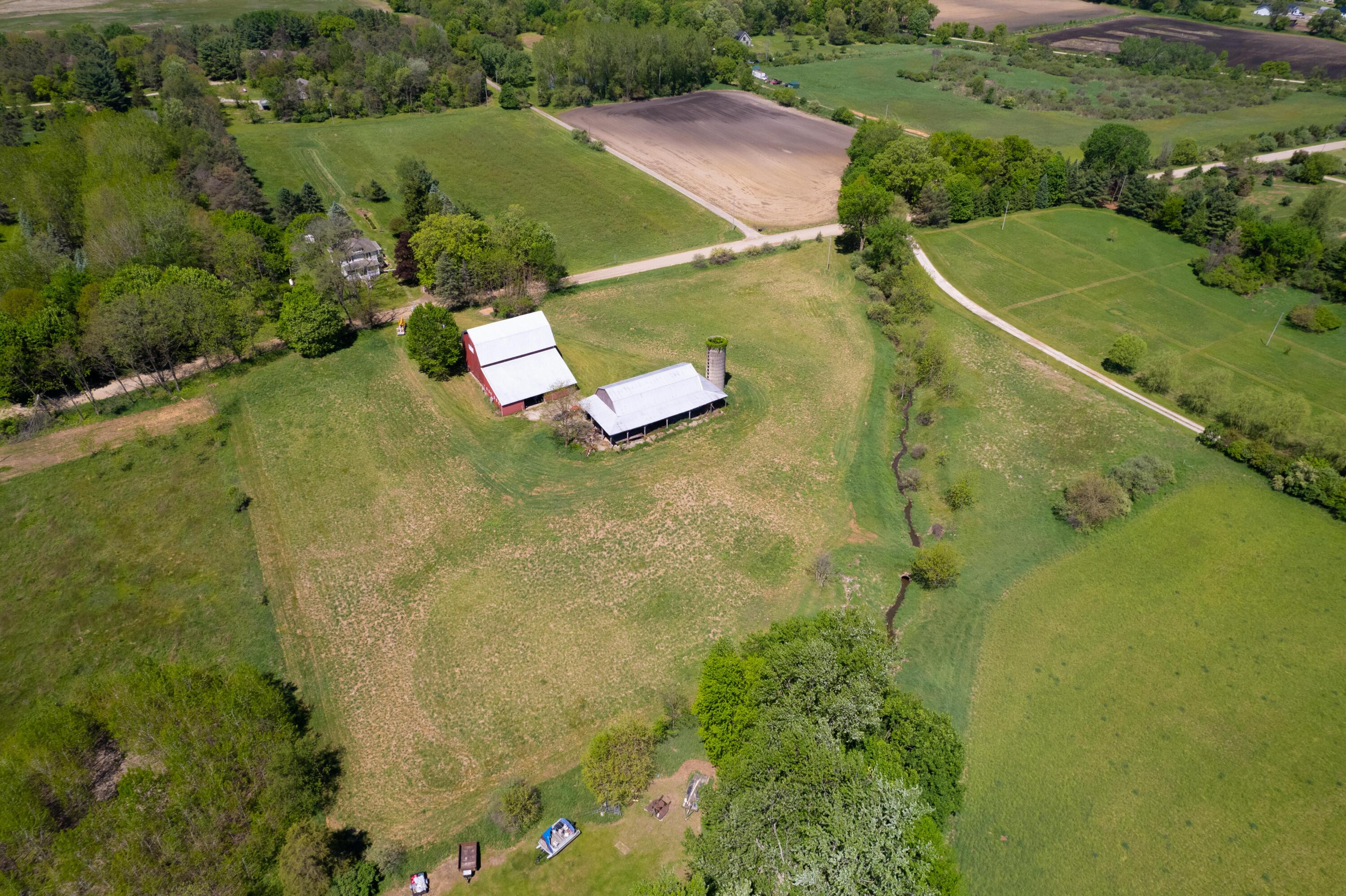 15610 Arnold Road Gregory, MI 48137 - Photo 82 of 90 Drone barns and stream