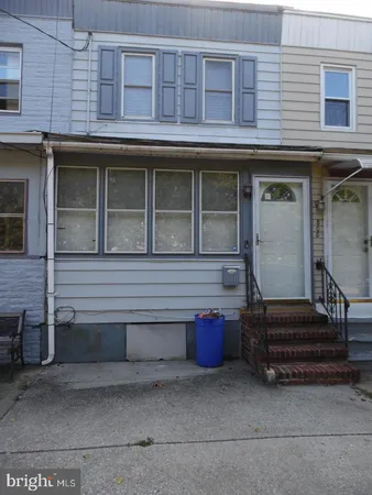 a view of a house with a large window and stairs