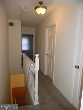 a view of a hallway with workspace