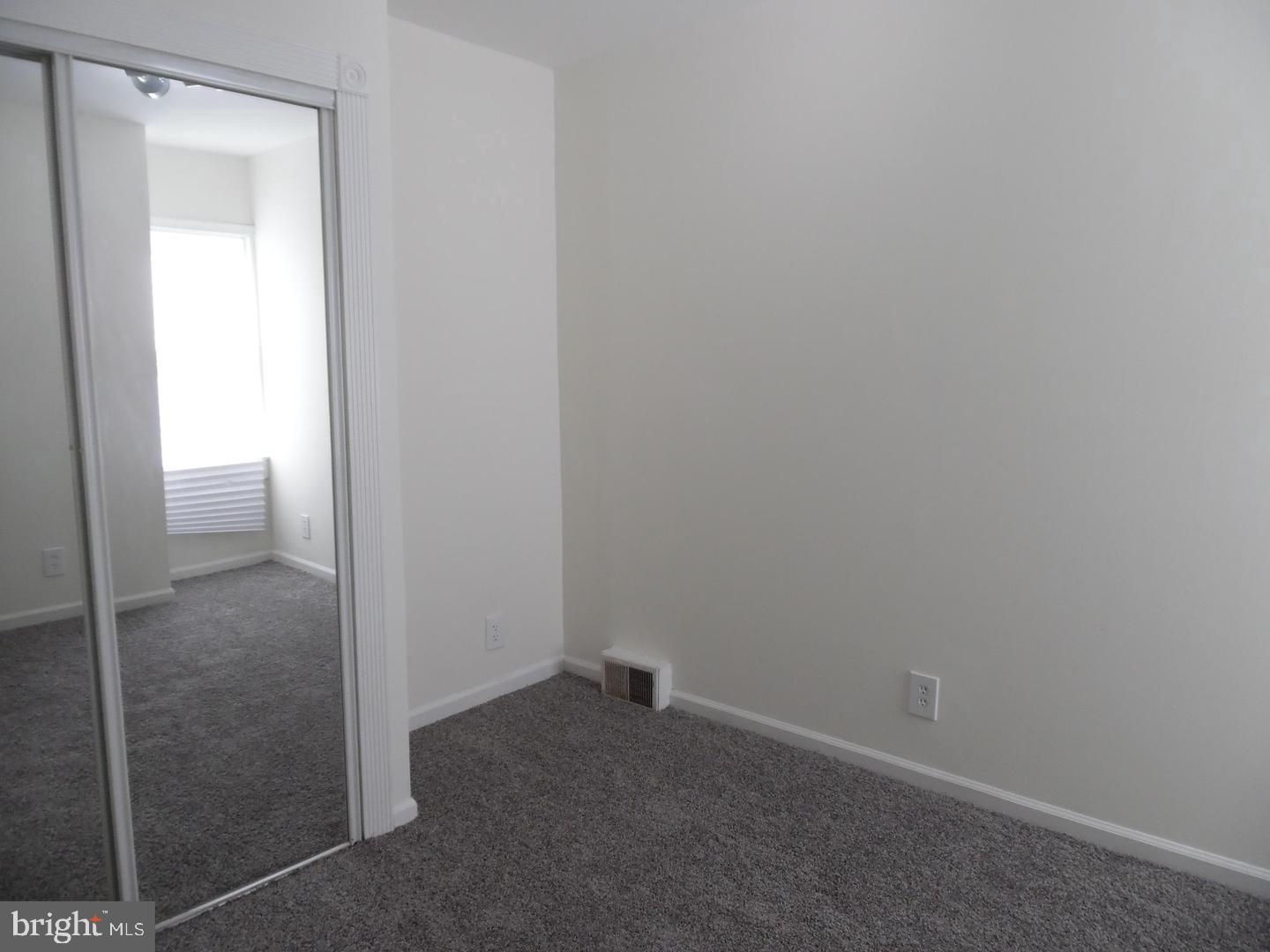 810 Powell Street Gloucester City, NJ 08030 - Photo 7 of 16 a room that has a glass door
