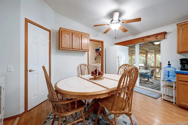 a view of a dining room with furniture and a chandelier