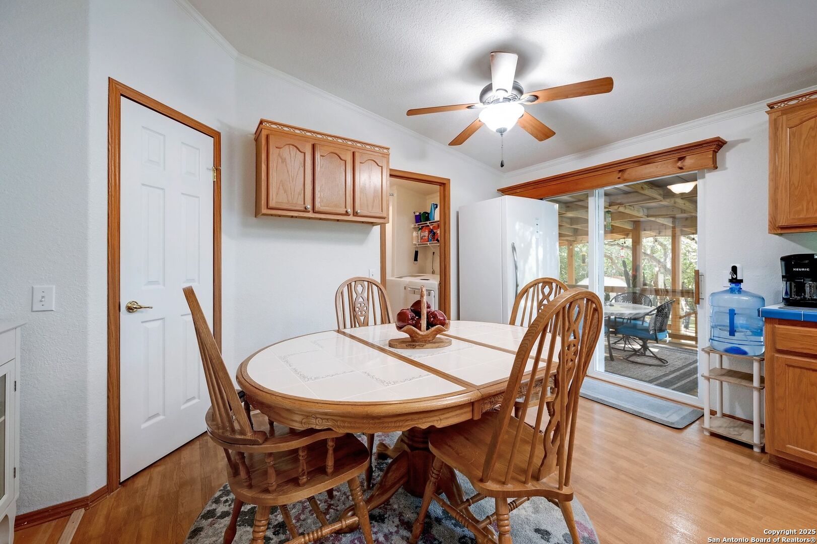 480 Rangeland Road Blanco, TX 78606 - Photo 15 of 26 a view of a dining room with furniture and a chandelier