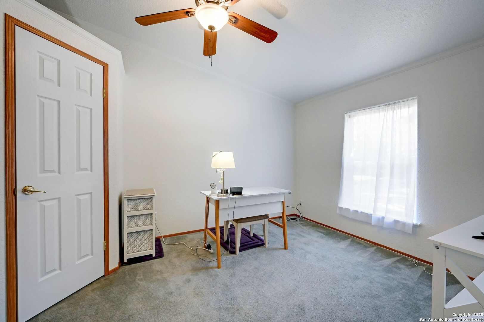 480 Rangeland Road Blanco, TX 78606 - Photo 17 of 26 a view of a workspace with furniture and a window