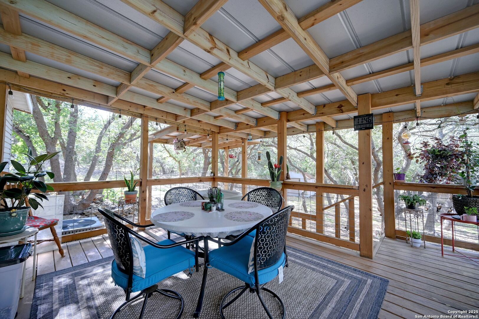 480 Rangeland Road Blanco, TX 78606 - Photo 20 of 26 a view of a dining room with furniture window and wooden floor
