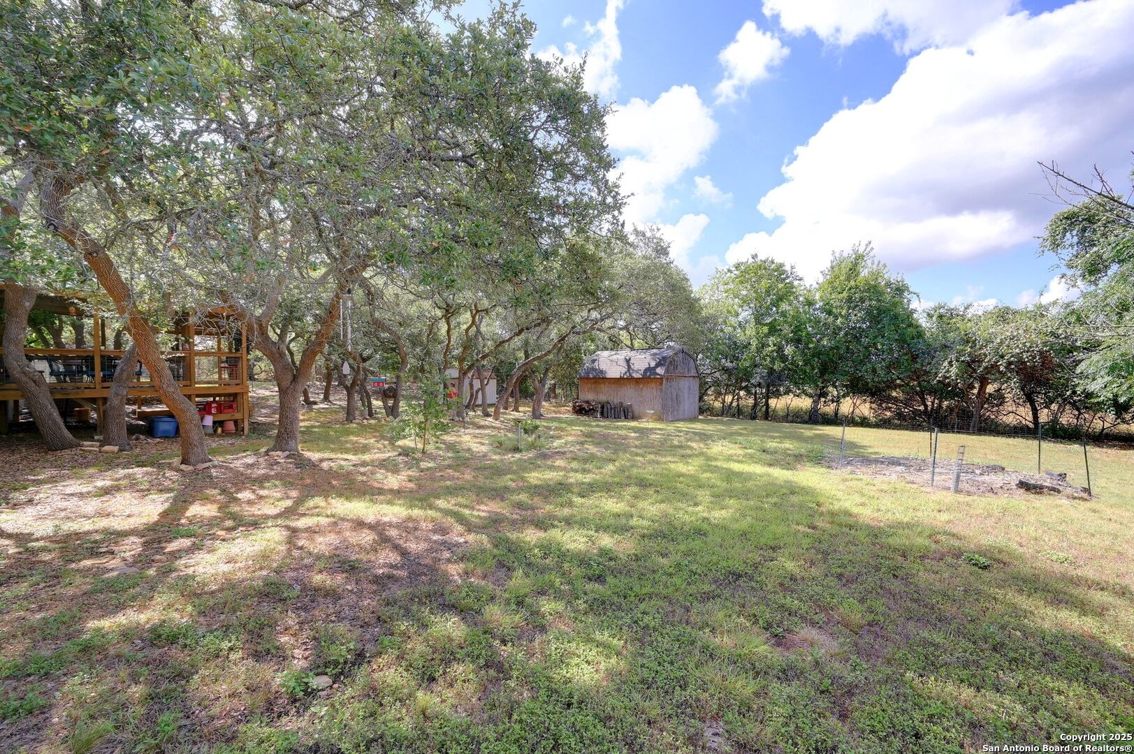 480 Rangeland Road Blanco, TX 78606 - Photo 23 of 26 a view of outdoor space with deck and yard