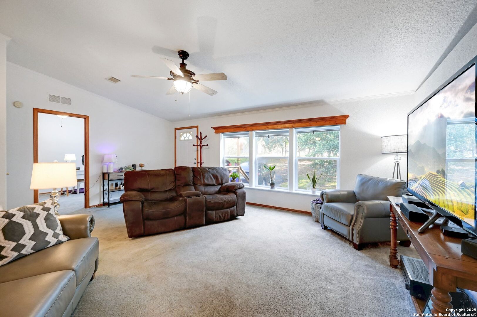 480 Rangeland Road Blanco, TX 78606 - Photo 4 of 26 a living room with furniture and a large window