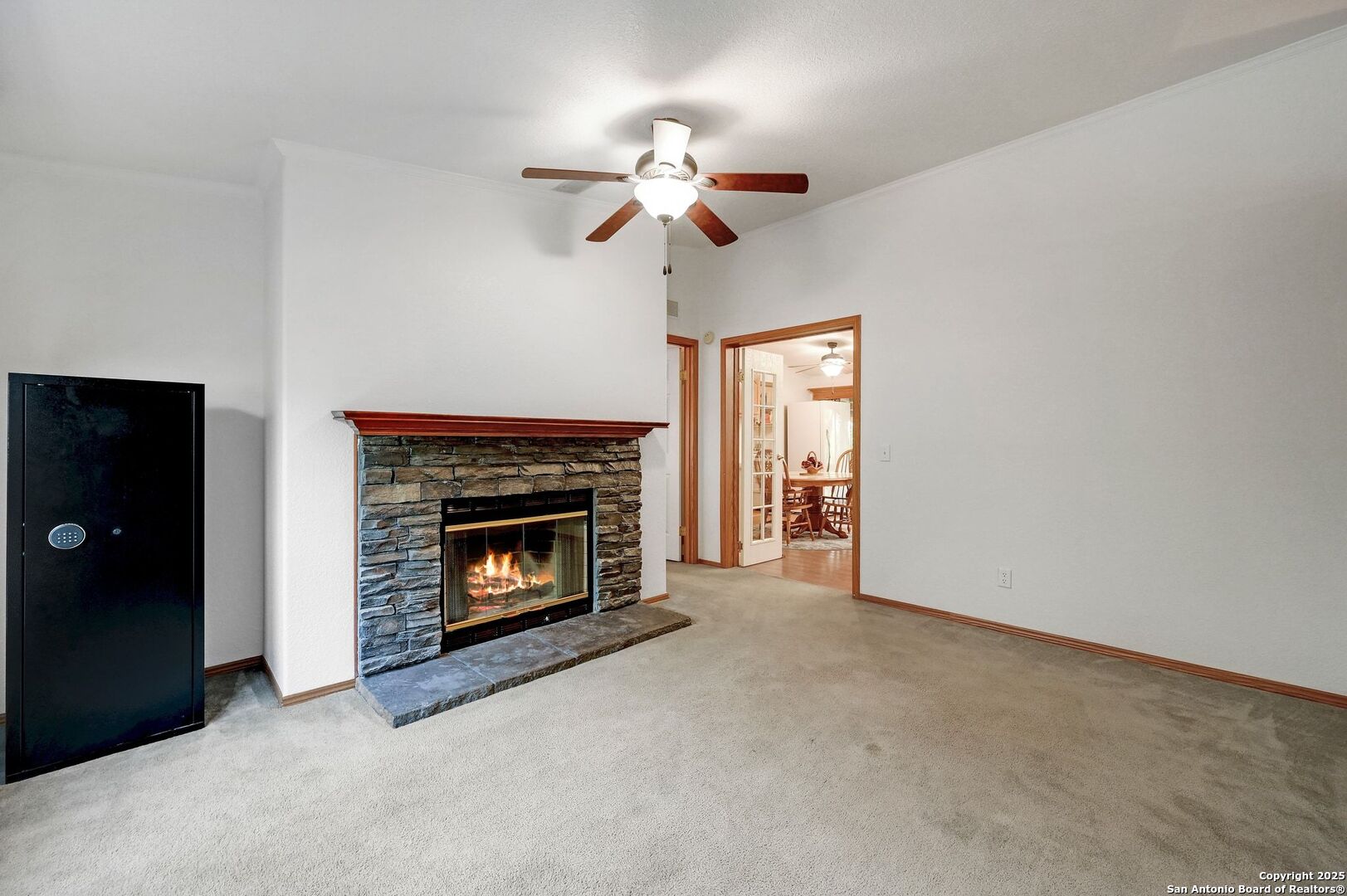 480 Rangeland Road Blanco, TX 78606 - Photo 9 of 26 a living room with furniture and a fireplace