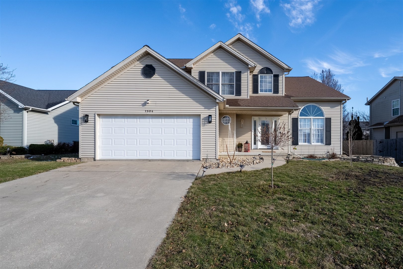 1504 Estate Drive Normal, IL 61761 - Photo 1 of 34 a front view of a house with a yard and garage