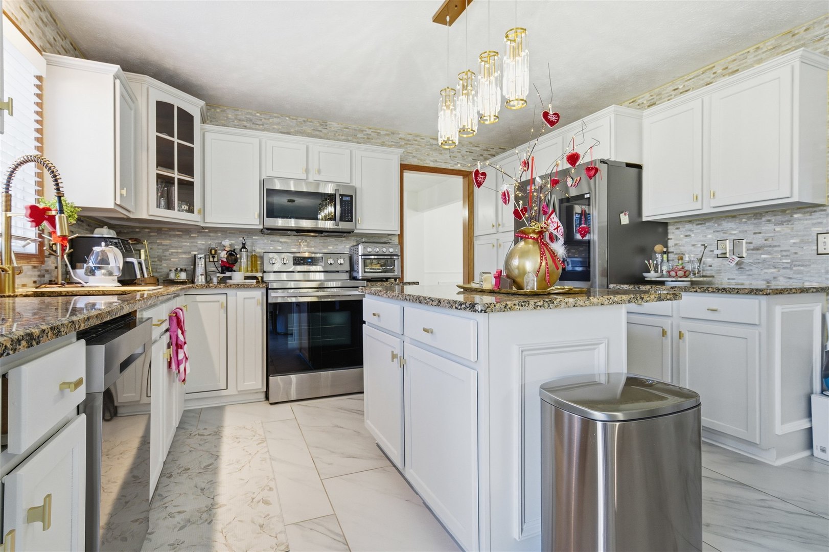 1504 Estate Drive Normal, IL 61761 - Photo 13 of 34 a kitchen with stainless steel appliances granite countertop a stove a sink dishwasher and a refrigerator