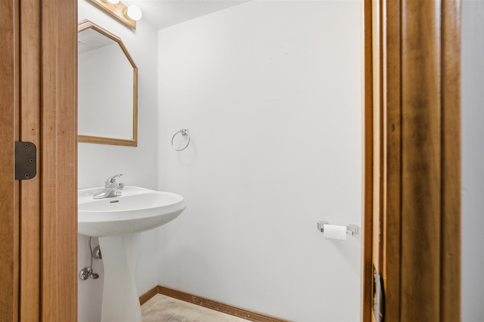 1504 Estate Drive Normal, IL 61761 - Photo 26 of 34 a bathroom with a sink a mirror and a window