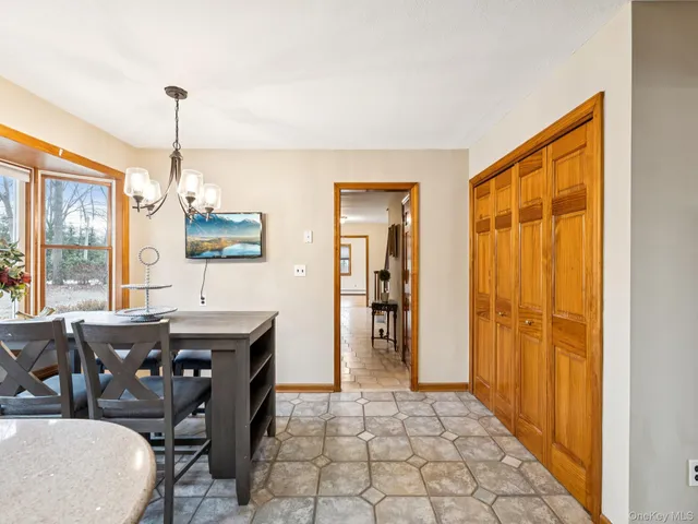 a view of a dining room with furniture window and outside view