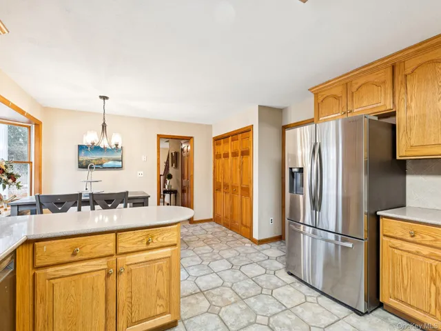 a kitchen with stainless steel appliances a refrigerator and a sink