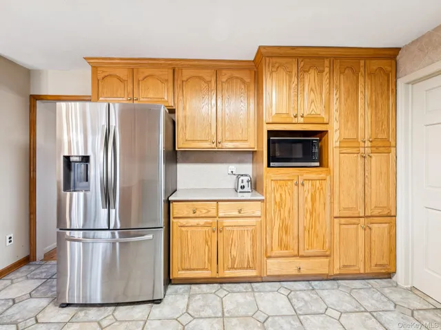a white refrigerator freezer and a stove top oven