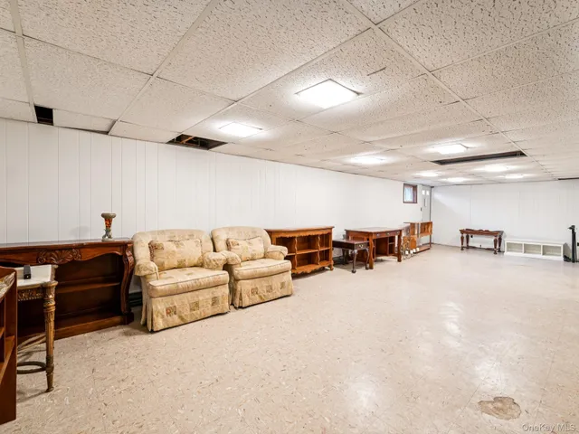 a living room with furniture and white walls