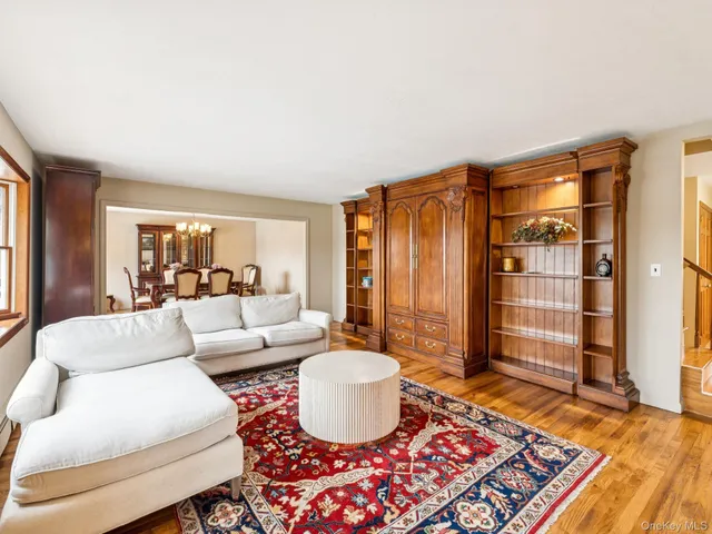 a living room with furniture and a rug
