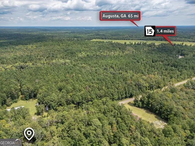 a view of a street with a bench in the background