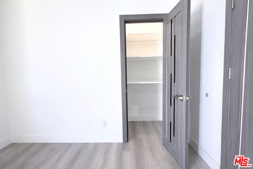 11836 Rialto Street Sun Valley, CA 91352 - Photo 11 of 34 a view of a room with wooden floor and a sink