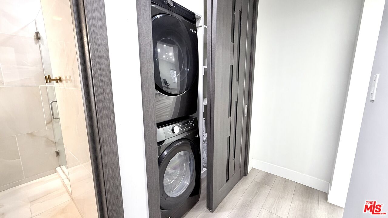 11836 Rialto Street Sun Valley, CA 91352 - Photo 14 of 34 a view of a hallway with washer and dryer