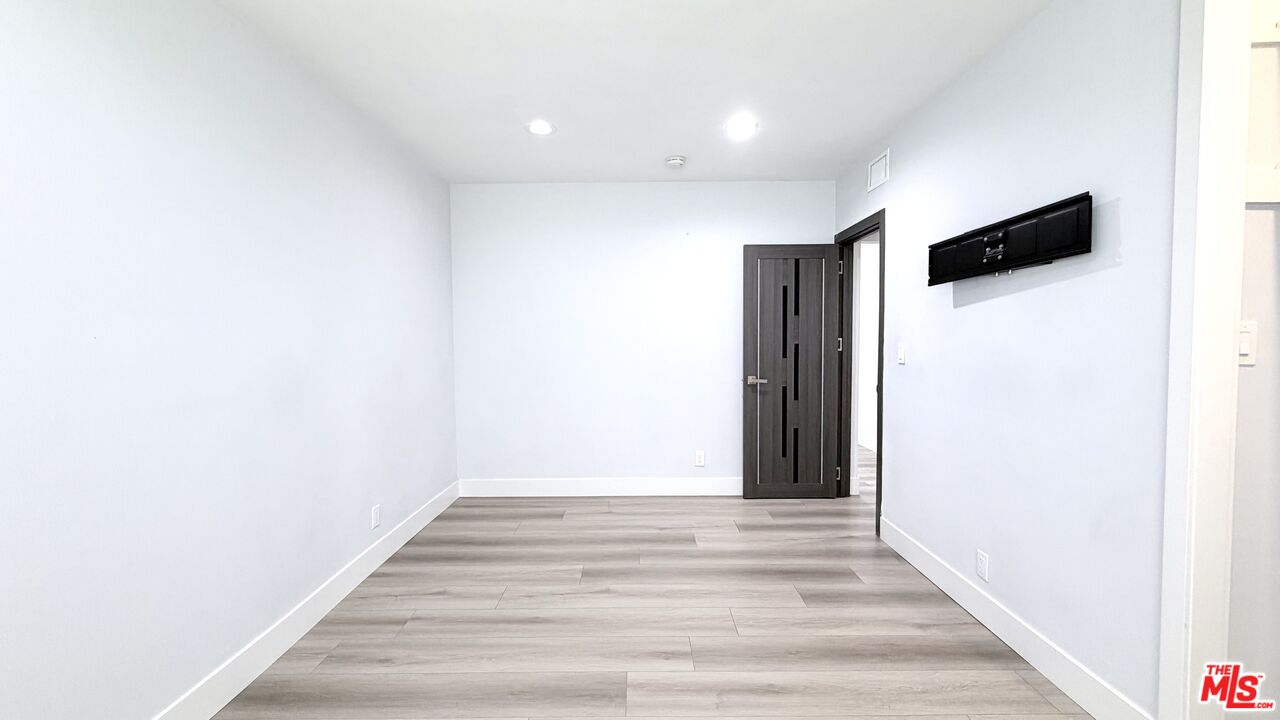 11836 Rialto Street Sun Valley, CA 91352 - Photo 22 of 34 a view of hallway with wooden floor