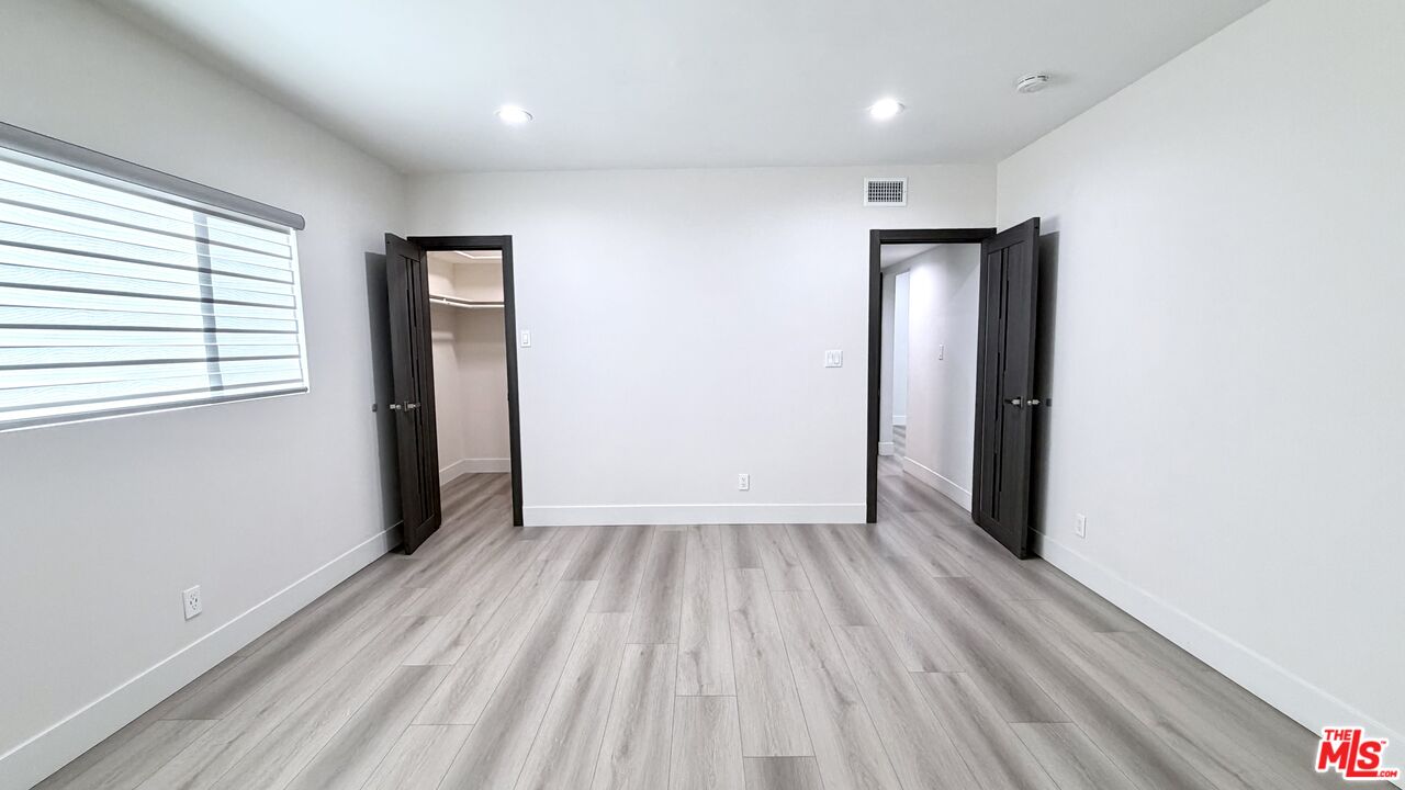 11836 Rialto Street Sun Valley, CA 91352 - Photo 27 of 34 wooden floor in an empty room with a window