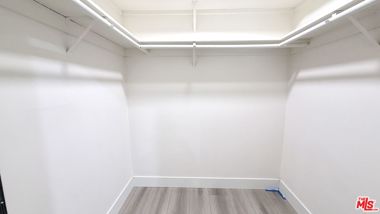 11836 Rialto Street Sun Valley, CA 91352 - Photo 28 of 34 a view of a room with racks on the wall