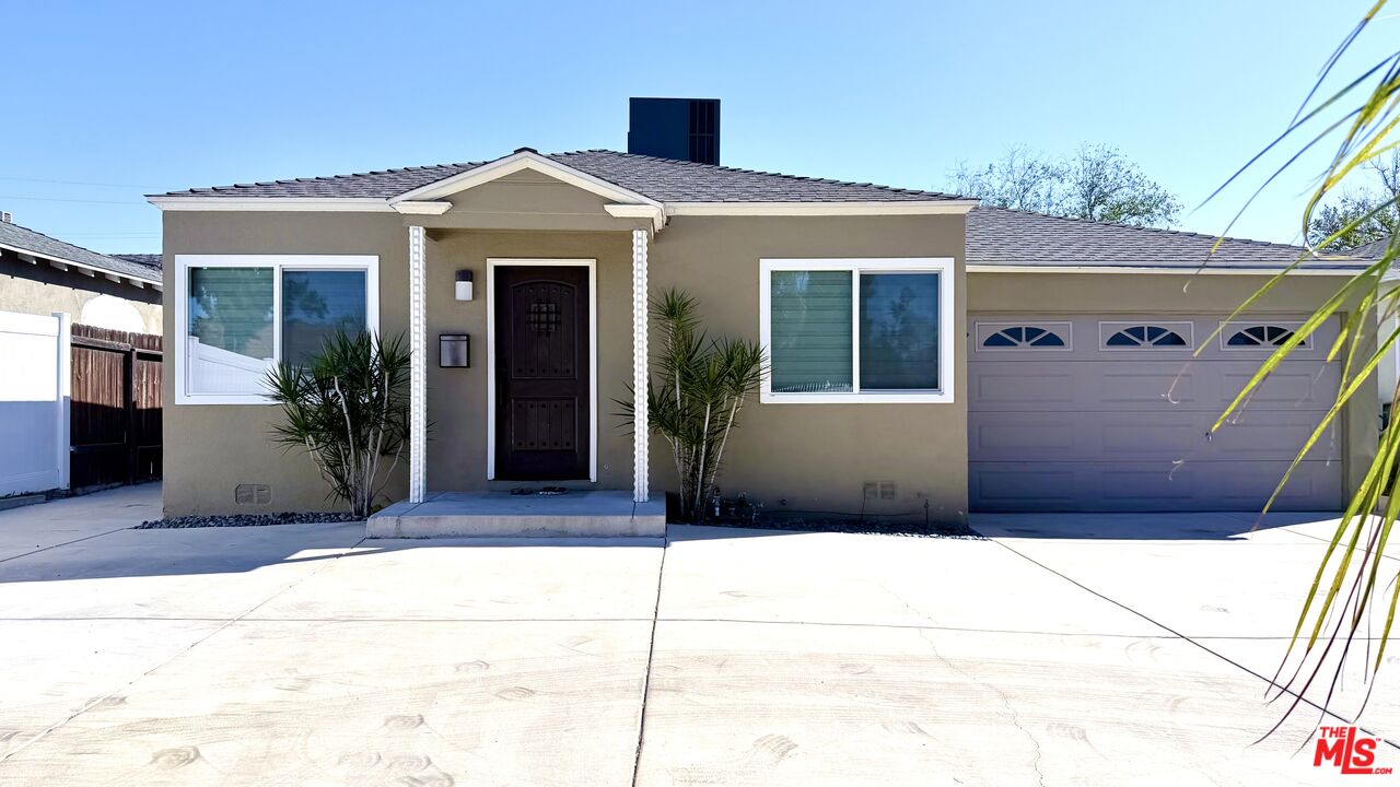 11836 Rialto Street Sun Valley, CA 91352 - Photo 3 of 34 a front view of a house with a garage
