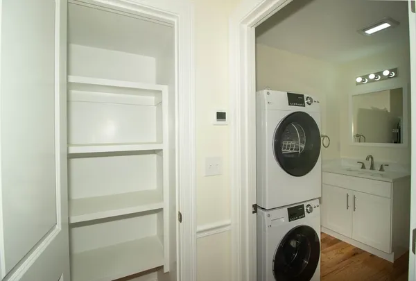 a view of a hallway with washer and dryer
