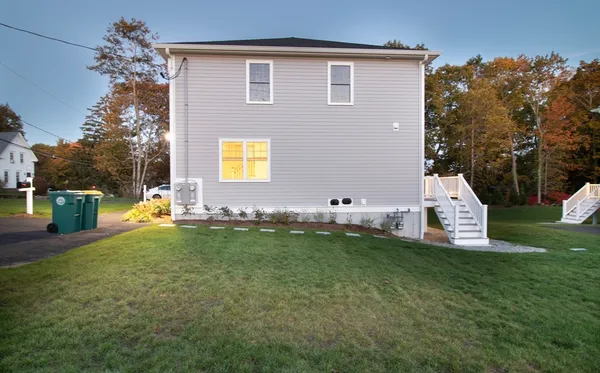 a view of house with a yard