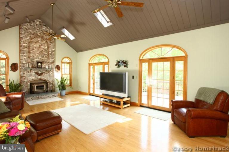 2637 Stockton Road Phoenix, MD 21131 - Photo 3 of 25 a living room with fireplace furniture and a large window