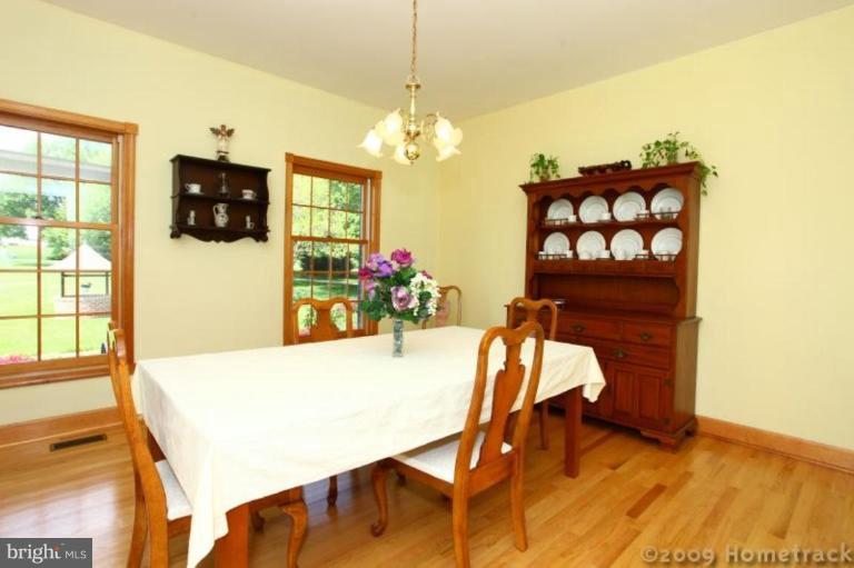 2637 Stockton Road Phoenix, MD 21131 - Photo 4 of 25 a view of a dining room with furniture and wooden floor