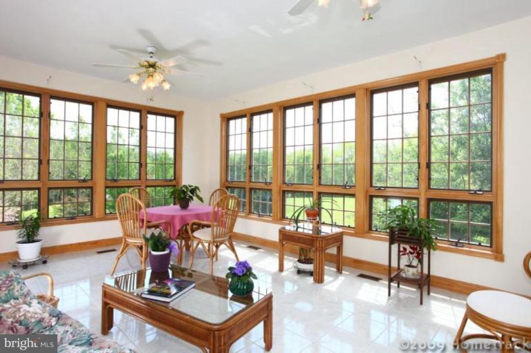 2637 Stockton Road Phoenix, MD 21131 - Photo 6 of 25 a living room with furniture and floor to ceiling windows