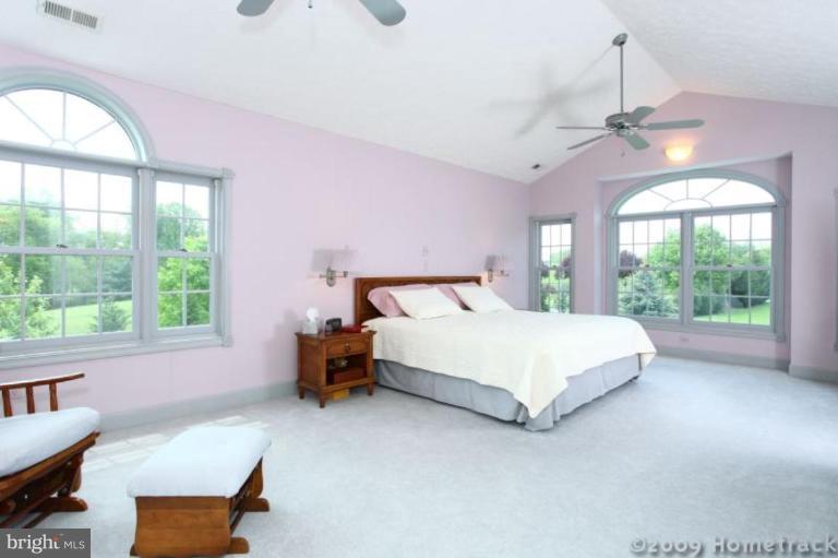 2637 Stockton Road Phoenix, MD 21131 - Photo 7 of 25 a bedroom with a bed window and couch