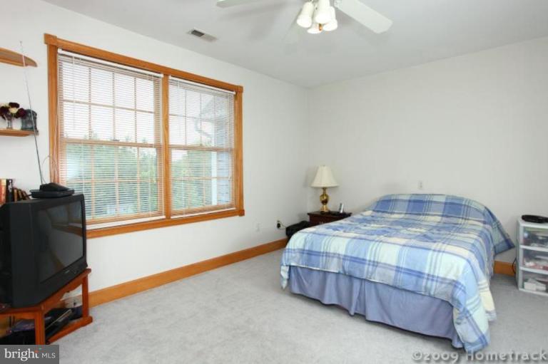 2637 Stockton Road Phoenix, MD 21131 - Photo 9 of 25 a bedroom with a bed and a window
