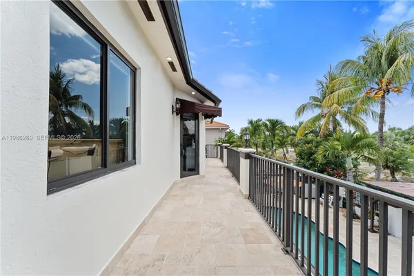 a view of walk in closet with clothes