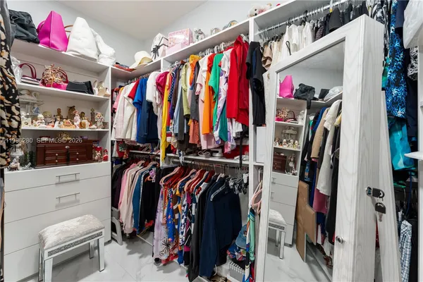 a bathroom with a double vanity sink mirror and shower
