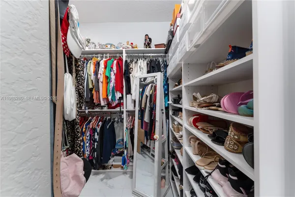 a bathroom with a bathtub sink and mirror