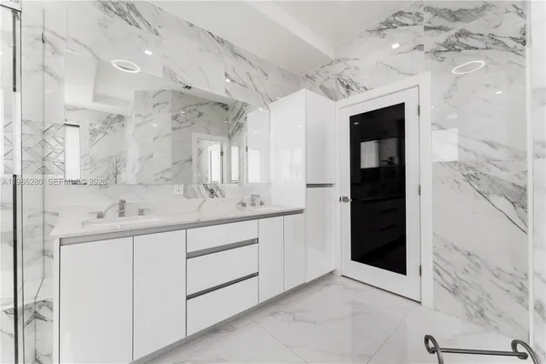 a white bath tub sitting in a bathroom