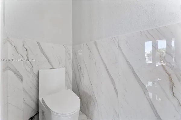 a view of a chairs and table in a room