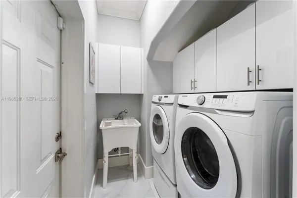 a view of a dinning table and chairs in patio of the house