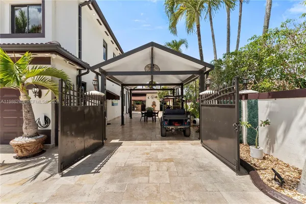 a view of a house with swimming pool and sitting area