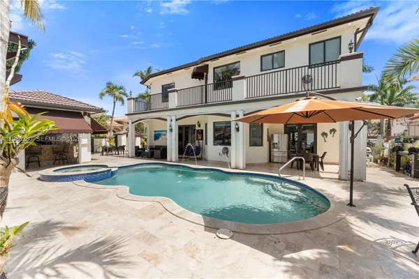 a bathroom with a shower a toilet and a sink
