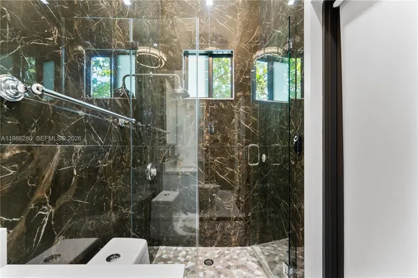 an aerial view of a house with a lake view