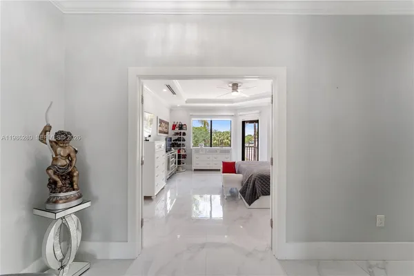 a bed room with a bed window and a television