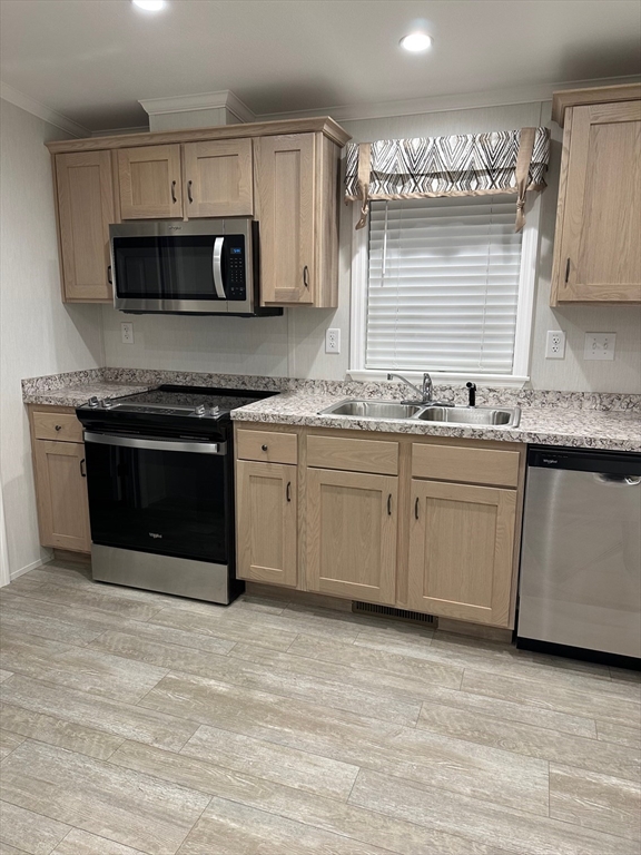 200 North Street Danvers, MA 01923 - Photo 3 of 16 a kitchen with stainless steel appliances granite countertop a stove a sink and a microwave