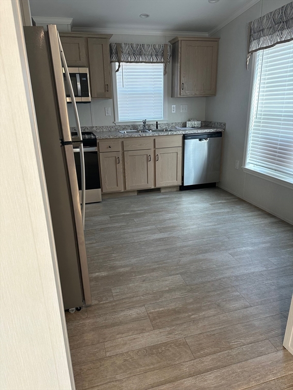 200 North Street Danvers, MA 01923 - Photo 4 of 16 a kitchen with granite countertop a refrigerator stove and sink