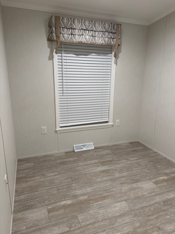 200 North Street Danvers, MA 01923 - Photo 7 of 16 a view of an empty room with wooden floor and a window