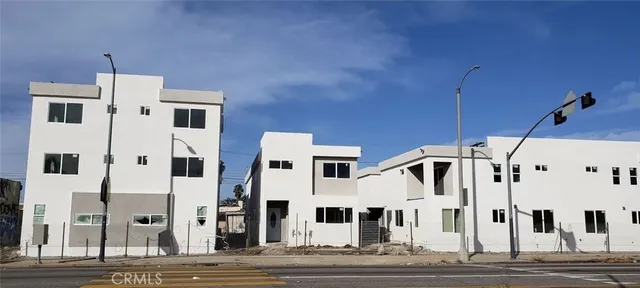 a view of a white building among the street