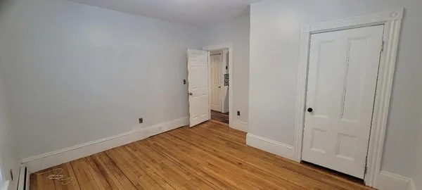 a bathroom with a shower and a glass door