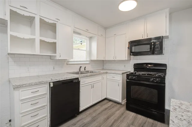 a kitchen with a stove and a microwave