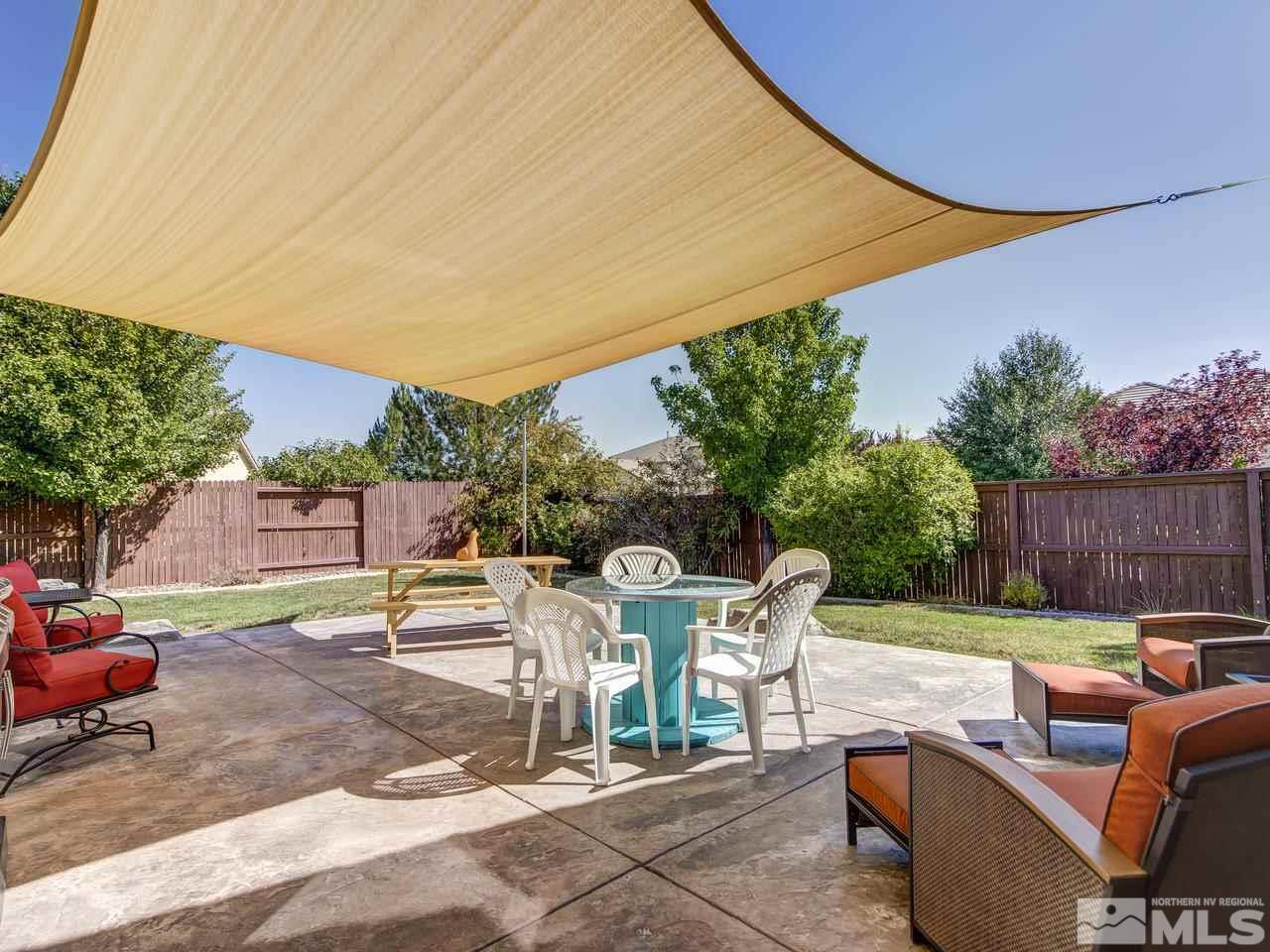 1695 Crater Court Reno, NV 89521 - Photo 21 of 25 a view of backyard with seating area and barbeque oven